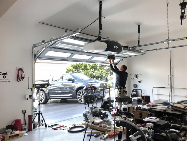 Fairview Park Garage Door Repair specialist installing smart garage door opener system in Fairview Park home