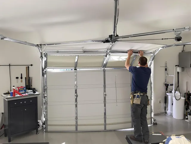 Fairview Park Garage Door Repair specialist performing precise section replacement on Fairview Park garage door